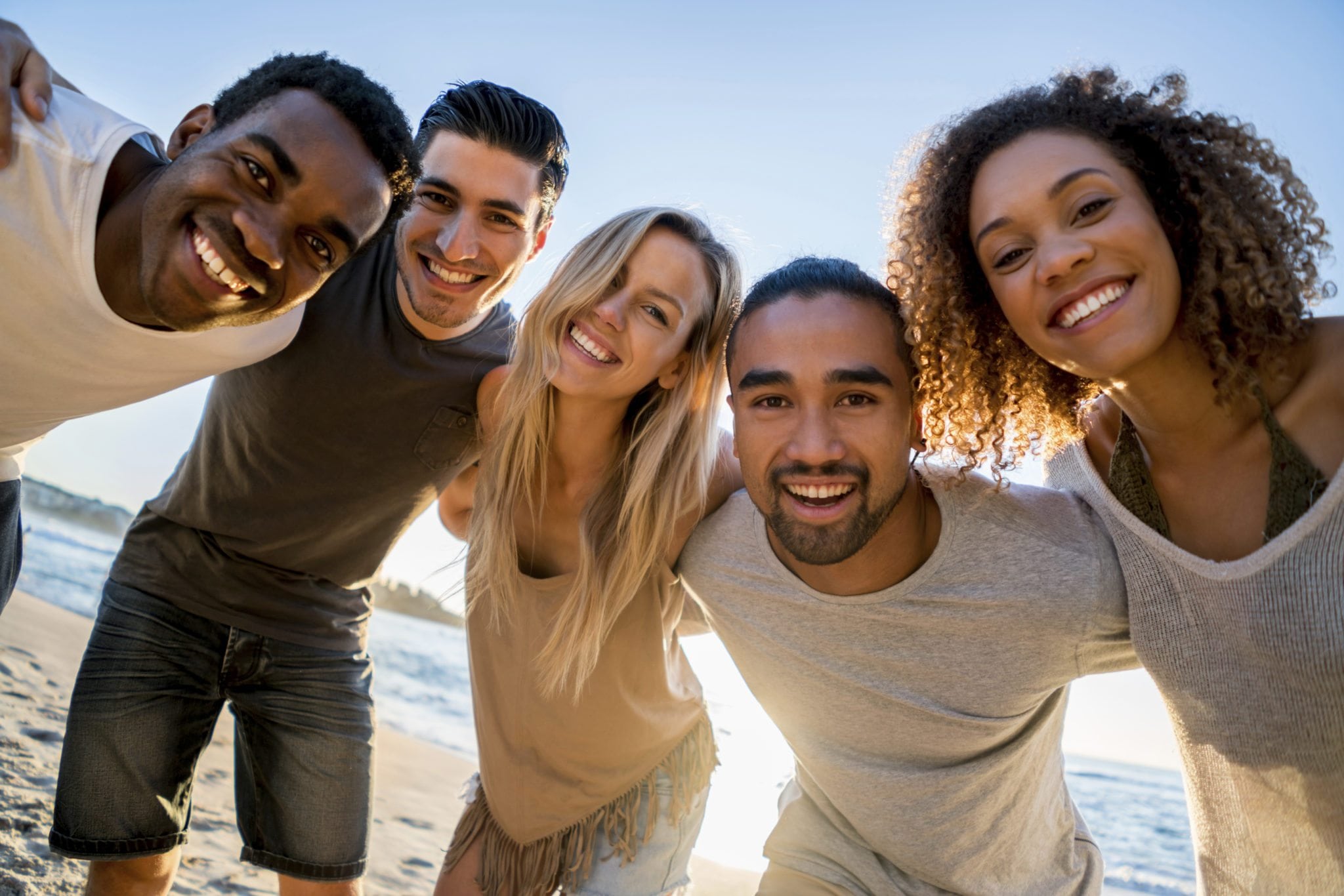 happy-group-of-friends-at-the-beach | TheCity.church